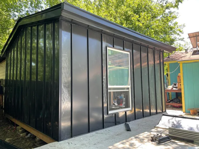 Black standing seam metal wall panels for Roof Inspection in Thatcher