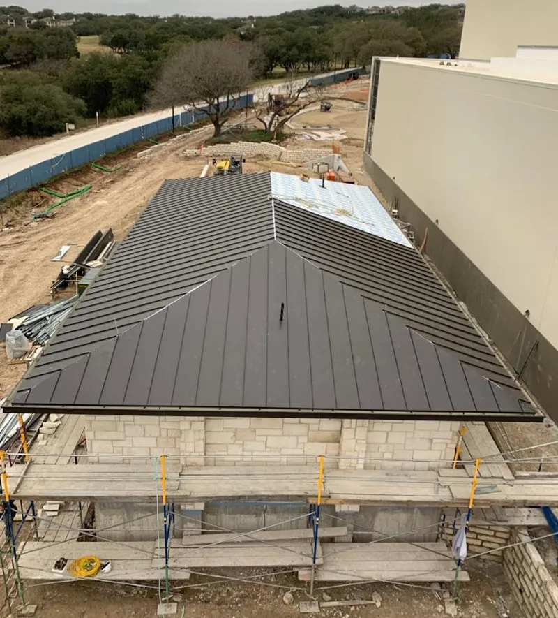 Metal roof new construction with scaffolding in Thatcher